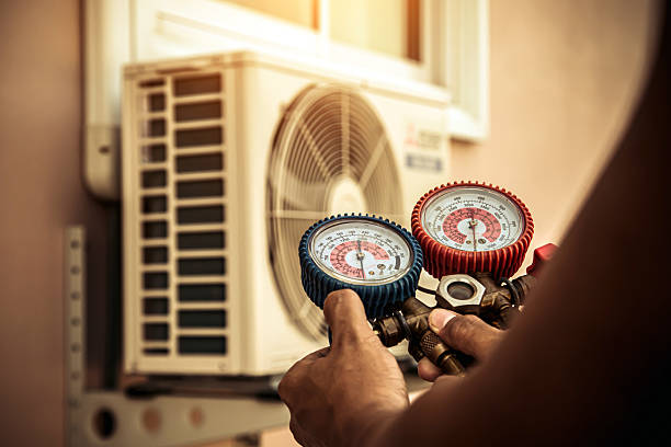 Professional Air Conditioning Service technician working in Stanton, NE